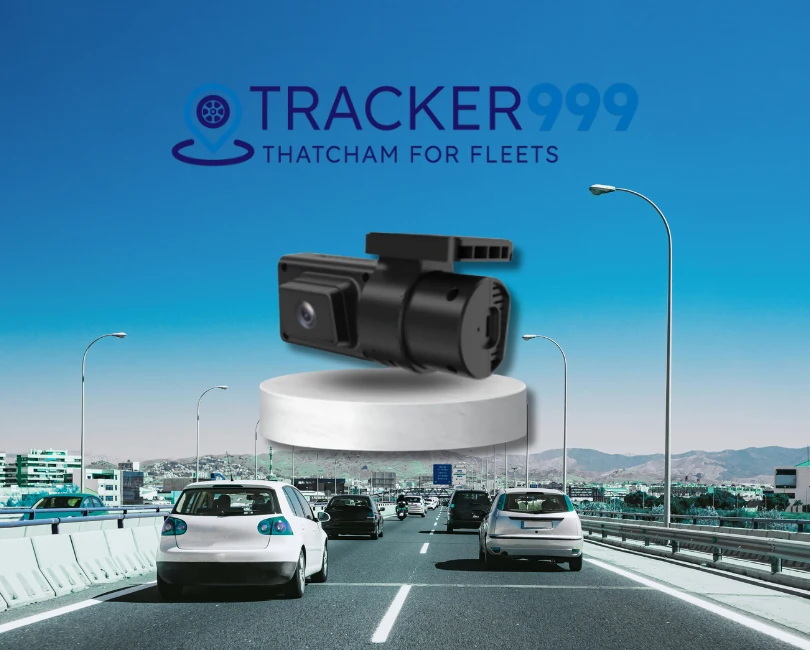 Dual dash cam displayed above busy motorway with Tracker999 logo and Thatcham approval message